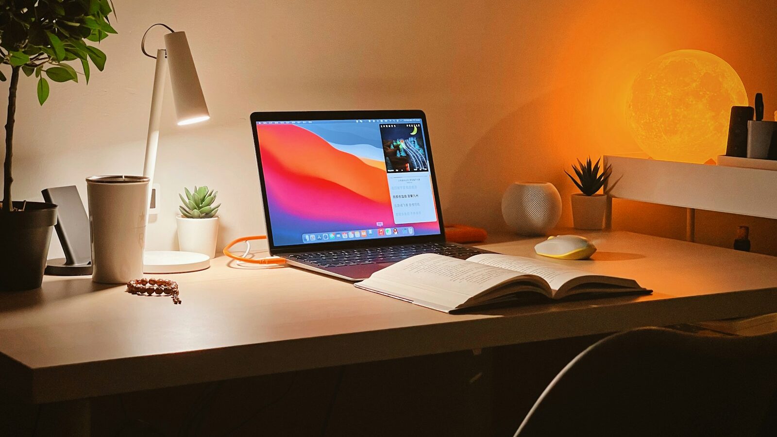 macbook pro on white wooden desk