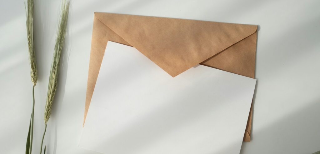 white paper and brown envelope