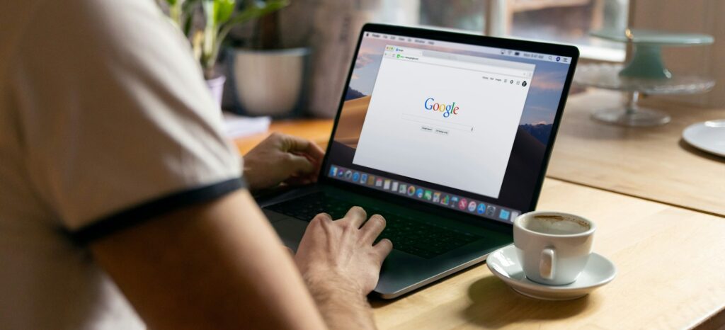 person using black laptop computer